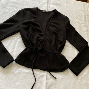 America Apparel wrap shirt. V neck. Long sleeve. Ties in the back. Size Small.